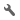 A grey wrench icon